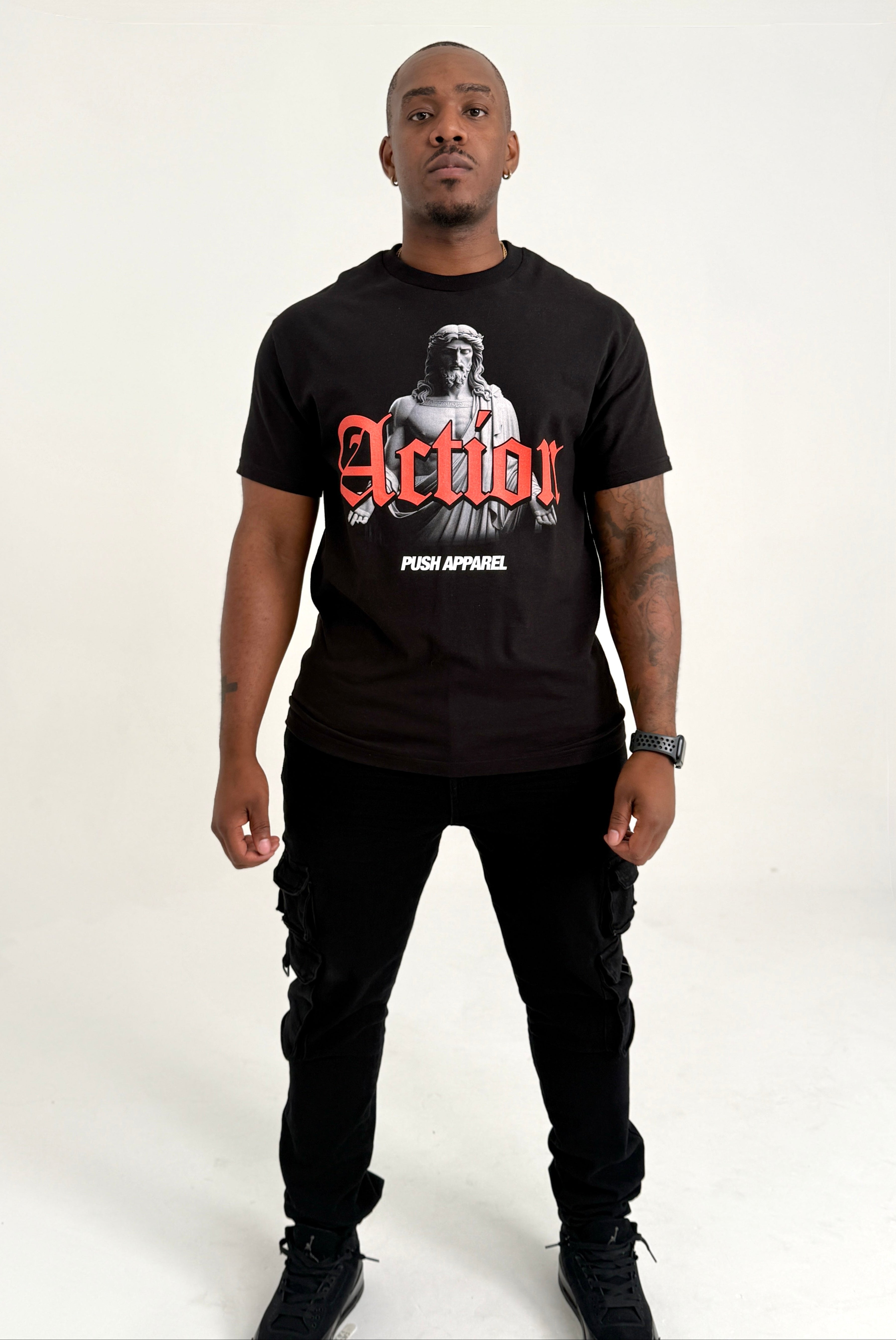 Man wearing a black t-shirt with graphic design and text on a white background